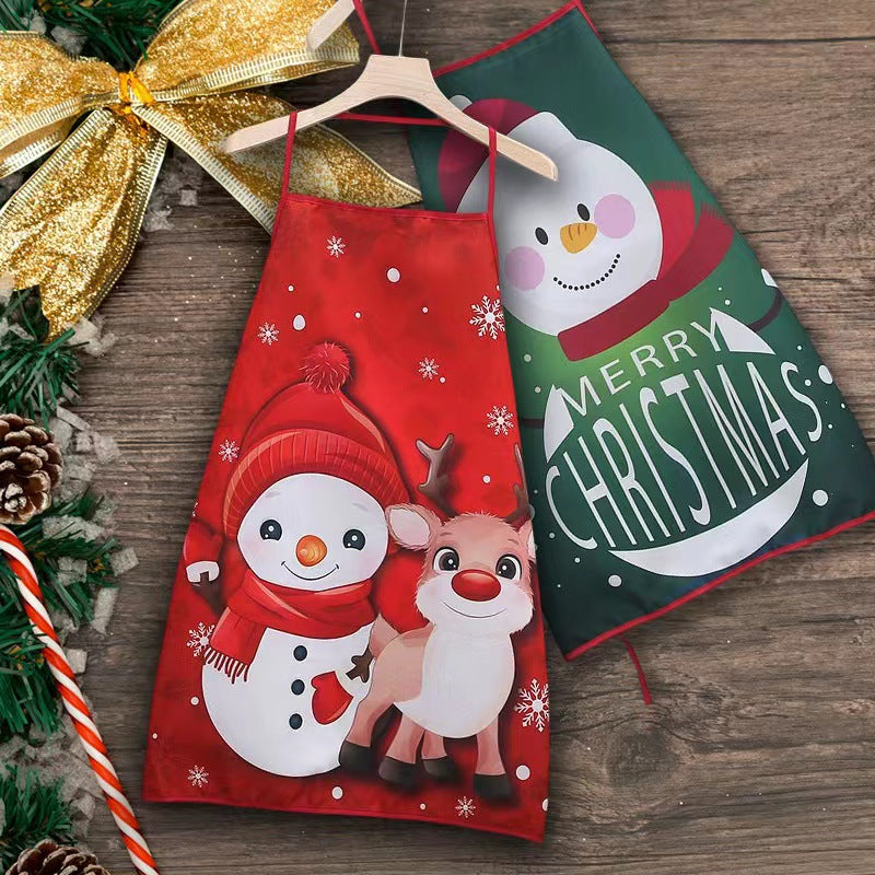 Vianočná zástera Winter Snug s červeným snehuliakom a sobom