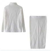 Eleanor Scott | Ensemble pull en maille à col roulé et jupe midi