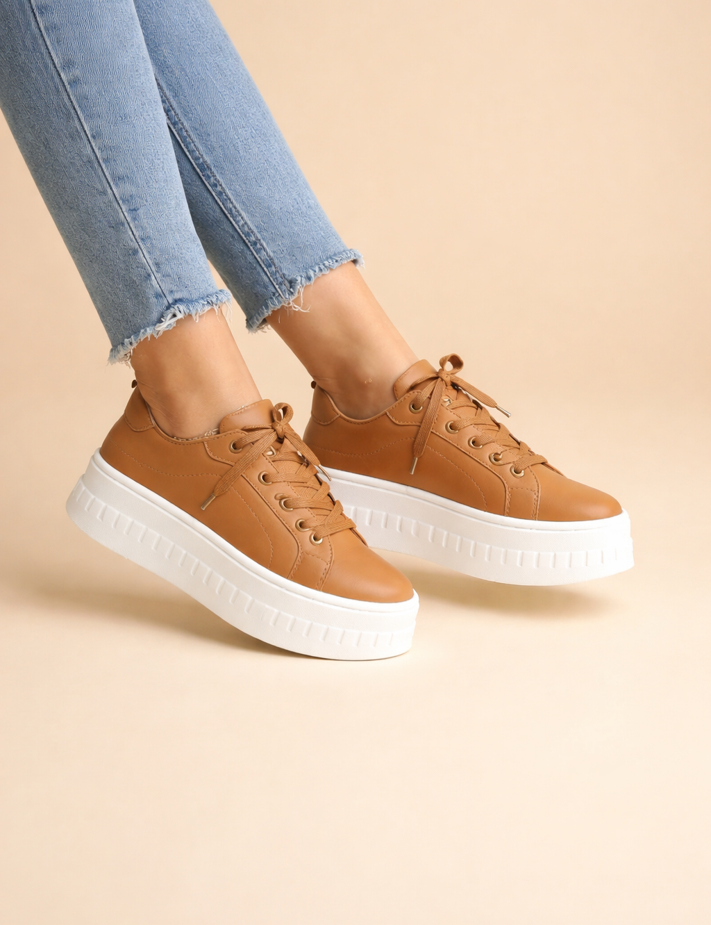 polish-female-model-wearing-tan-platform-sneakers-european-studio-fashion-pose.png